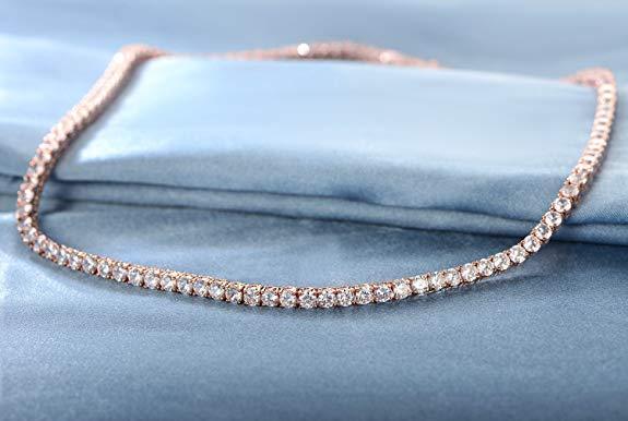 Delicate 18K gold-plated crystal choker necklace with fold-over clasp, displayed in gold finish on neutral background.