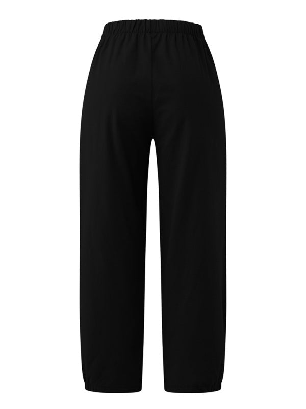 Back view of black cropped wide-leg pants highlighting rear fit at Tela Designs Store.
