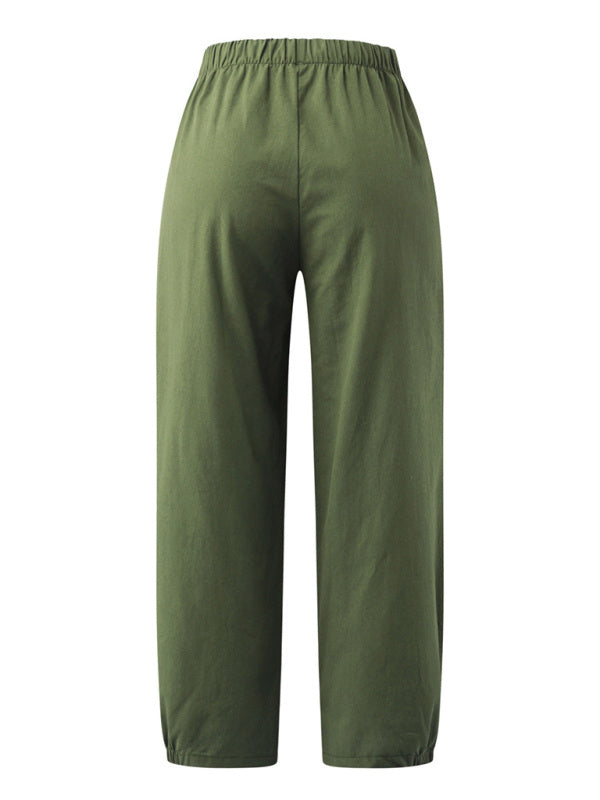 Displaying rear fit and flowy structure of the breathable sage green cotton-linen pants at Tela Designs Store.