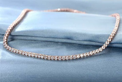 Delicate 18K gold-plated crystal choker necklace with fold-over clasp, displayed in gold finish on neutral background.