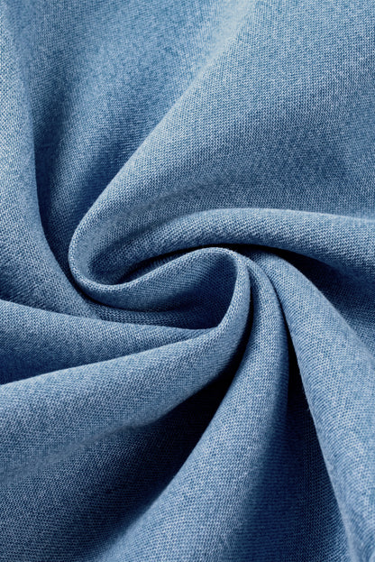 Close-up swirl of lightweight chambray denim fabric showing soft texture and weave at Tela Designs Store