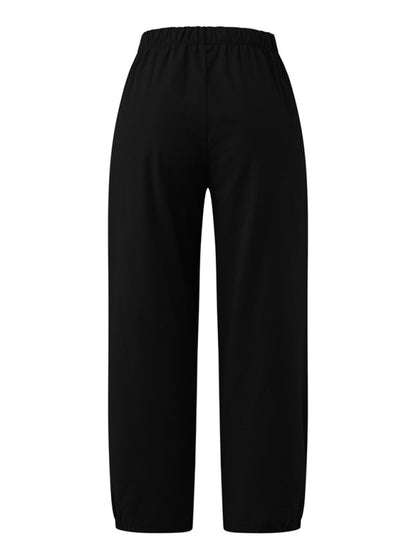 Back view of black cropped wide-leg pants highlighting rear fit at Tela Designs Store.
