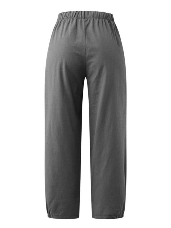 Displaying rear fit and flowy structure of the breathable grey cotton-linen pants by Tela Designs Store.
